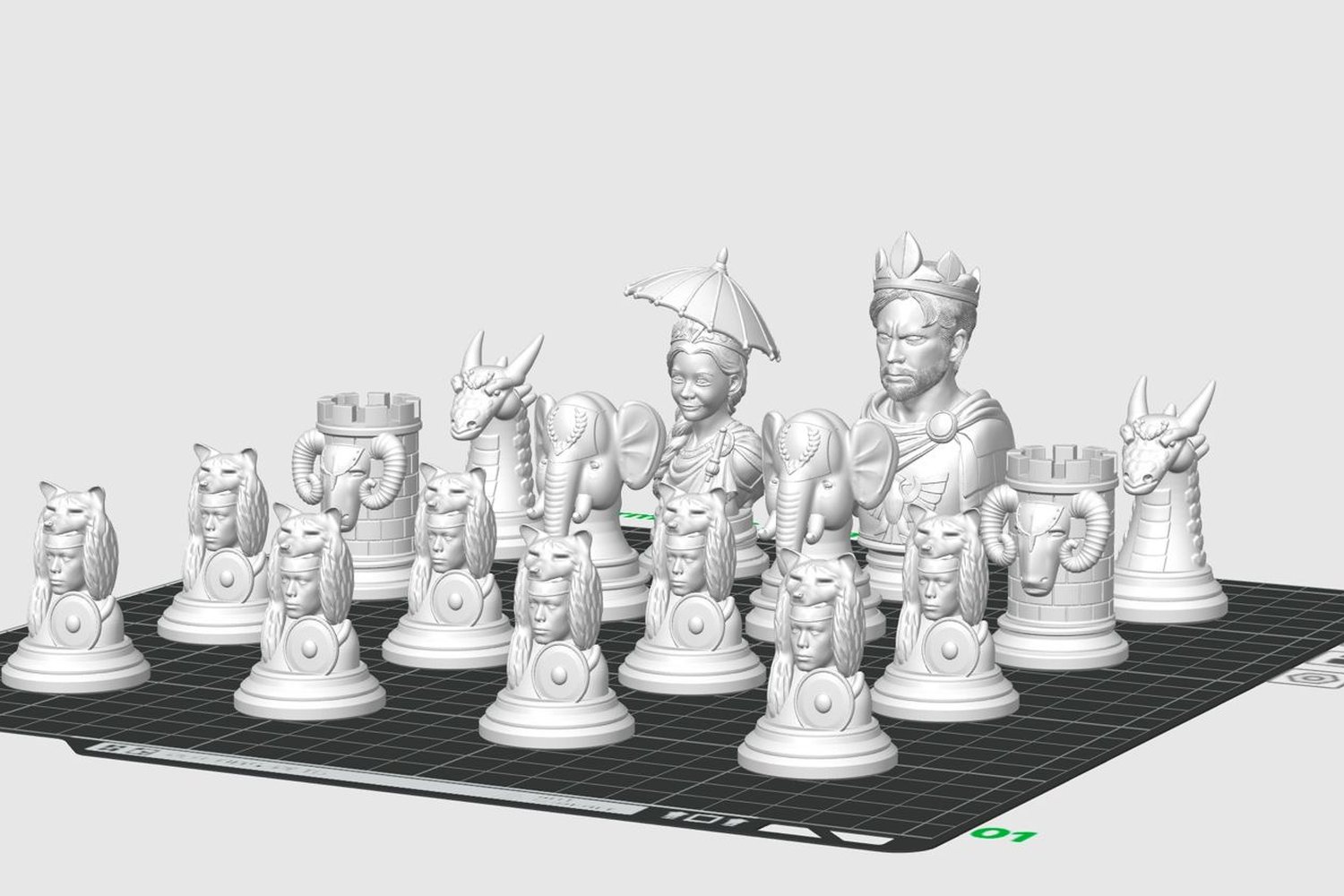 The full chess army laid out in the slicer: crowned king, queen under a parasol, dragon knights, elephants and wolf-helmet pawns