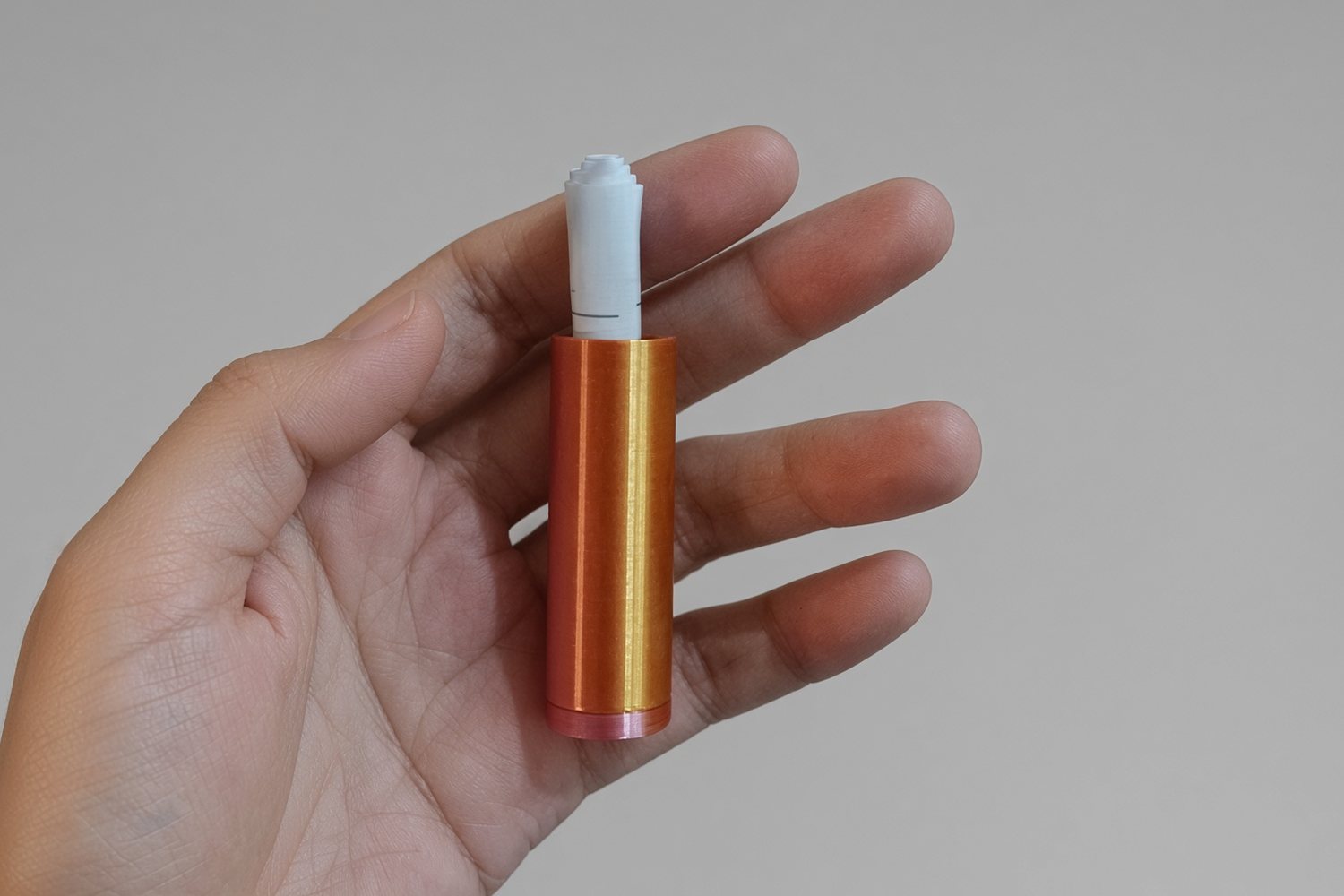 The scroll tube out of her hands, opened, held between two fingers